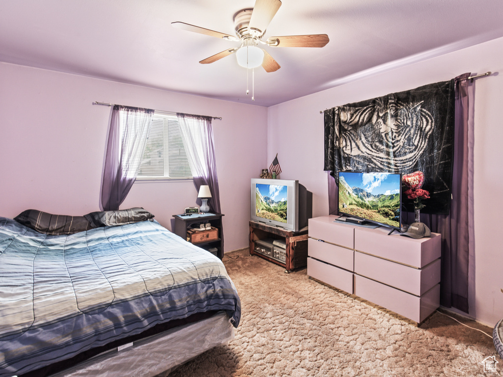 Bedroom with light carpet and ceiling fan