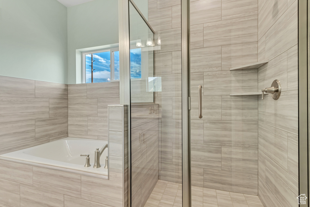 Bathroom with shower with separate bathtub