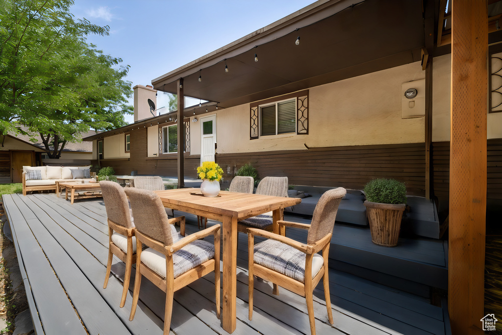 Wooden terrace with an outdoor hangout area