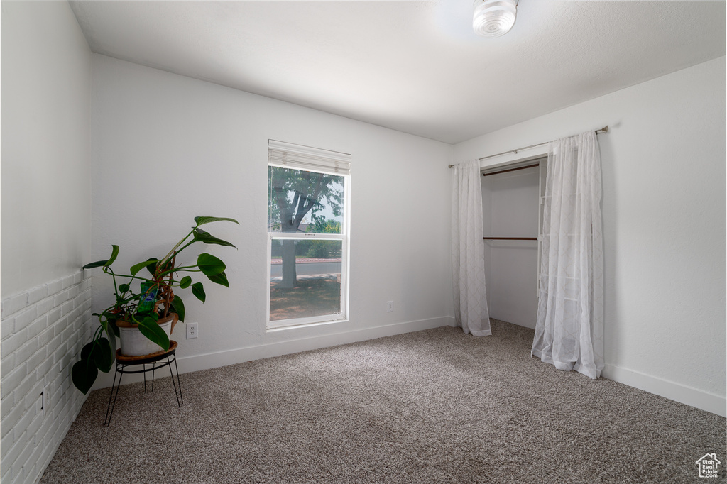 Unfurnished bedroom featuring carpet flooring