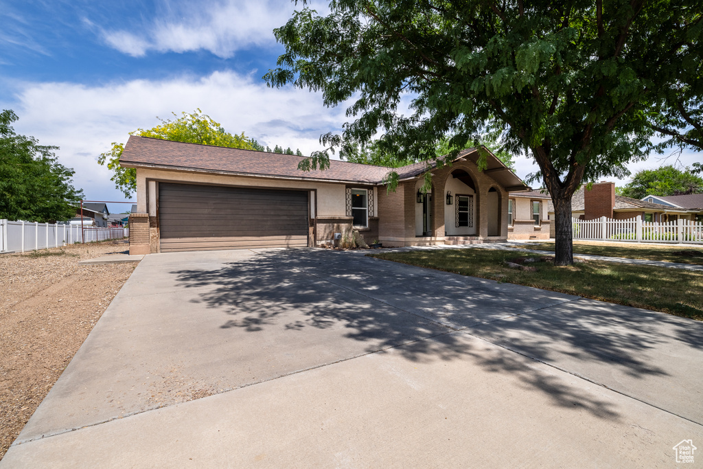 Single story home featuring a garage