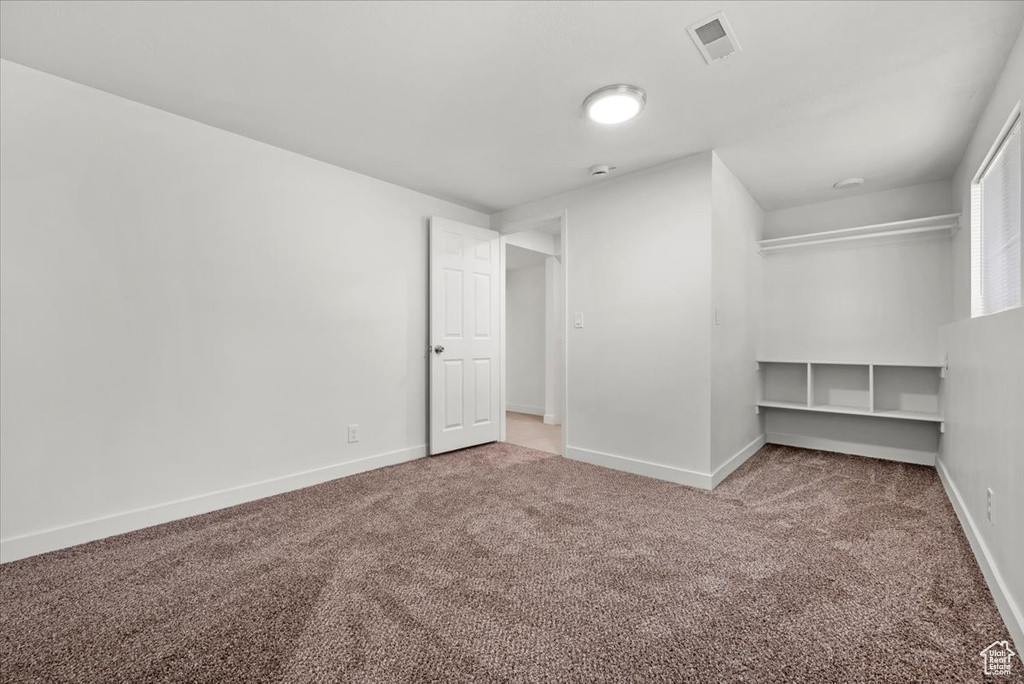 Unfurnished room with carpet floors