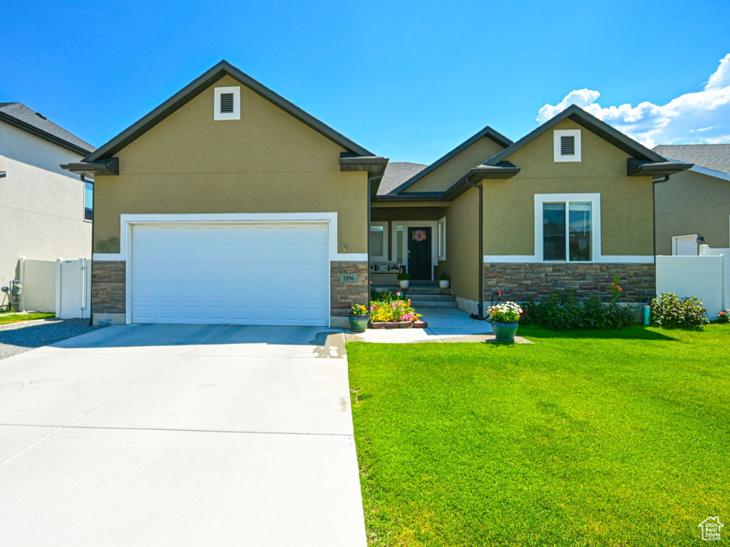 View of front of property with a front lawn