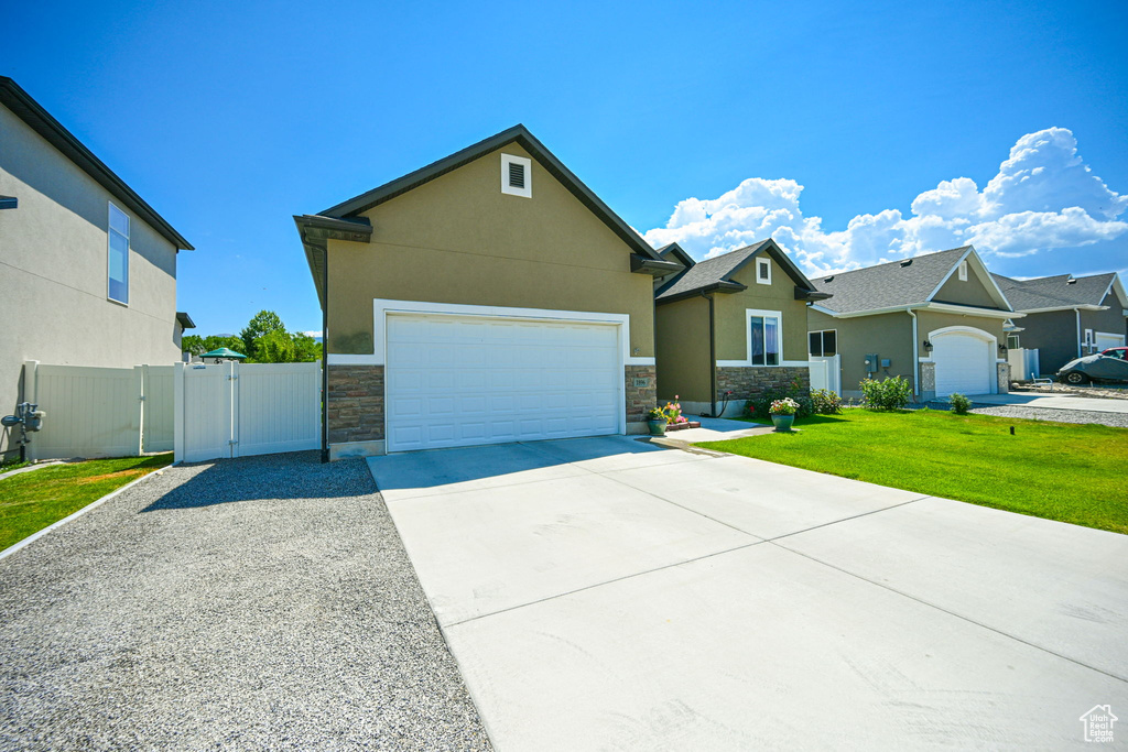 View of front of property featuring a garage