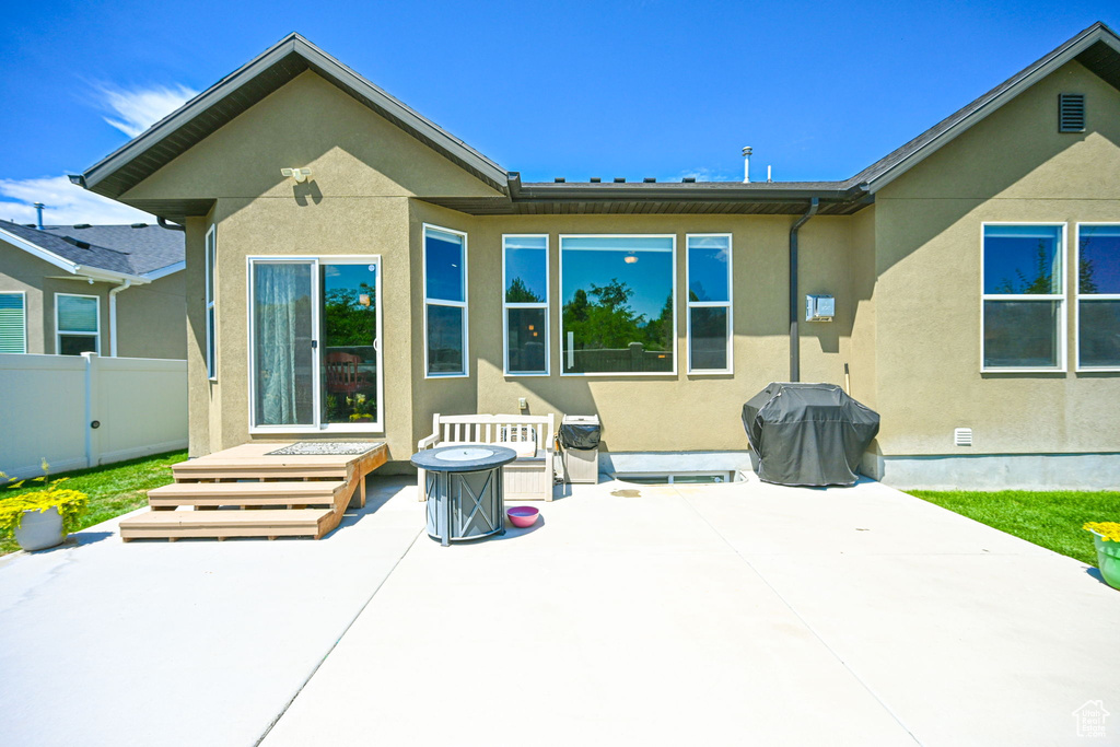 Rear view of house featuring a patio