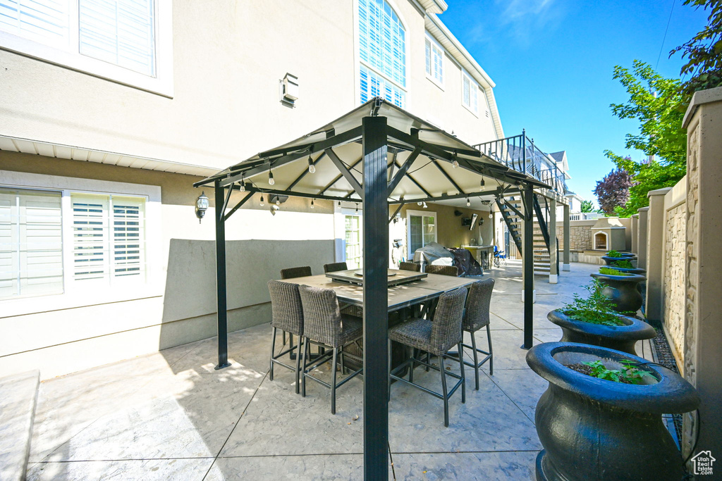 View of patio featuring a gazebo