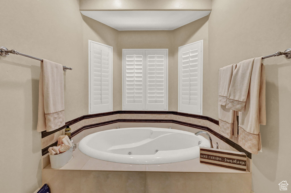 Bathroom featuring tiled tub