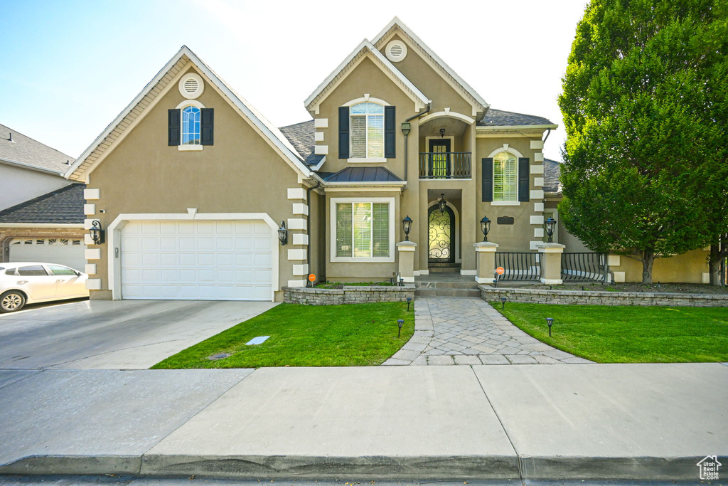 View of front of home with a balcony