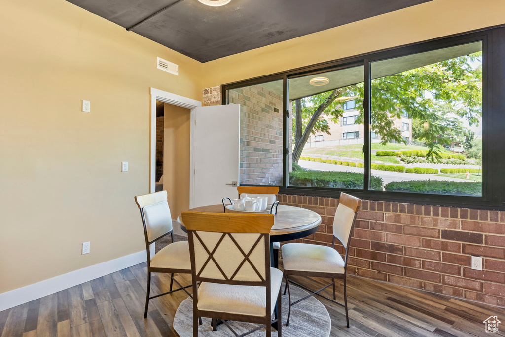 Dining room featuring hardwood / wood-style floors and a wealth of natural light