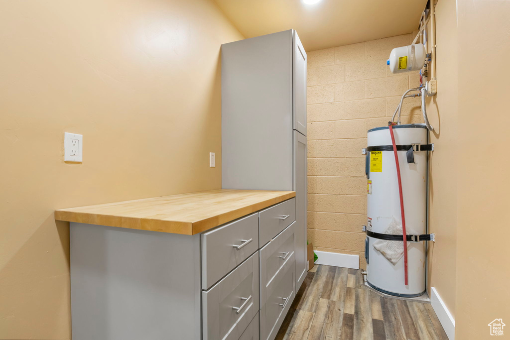 Interior space featuring strapped water heater