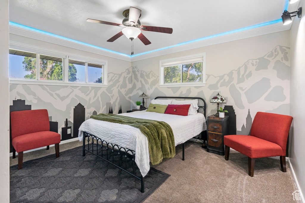 Bedroom featuring crown molding, carpet, and ceiling fan