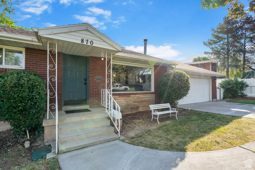 View of front of property featuring a garage