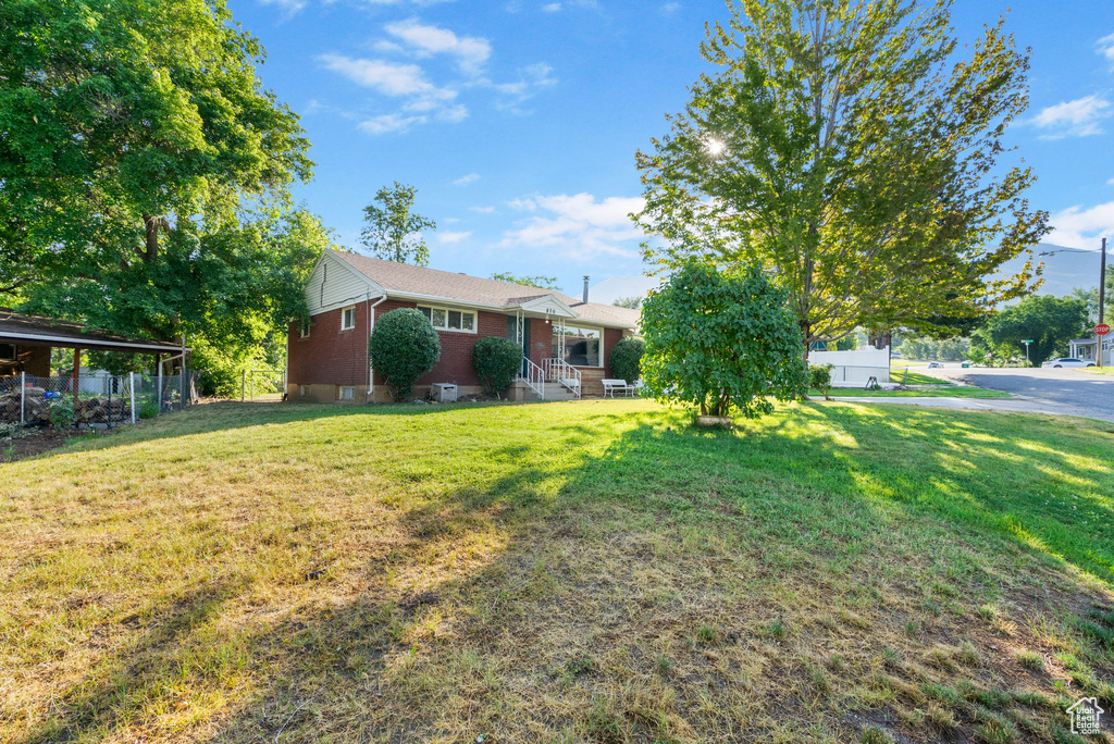 View of yard featuring a carport