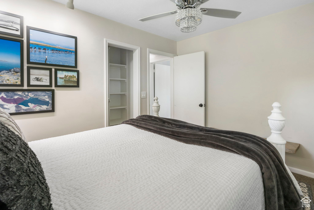 Bedroom with ceiling fan and carpet flooring