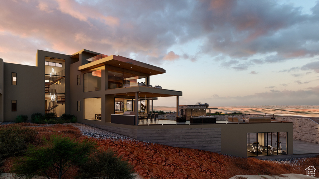 Exterior space with a balcony and a patio