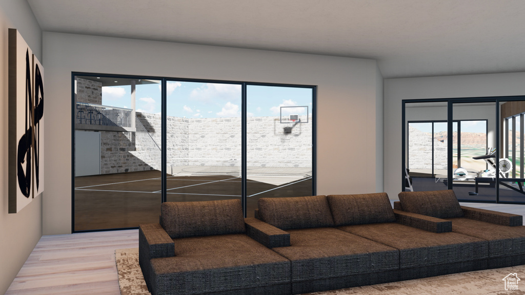 Living room with light hardwood / wood-style flooring and a wealth of natural light