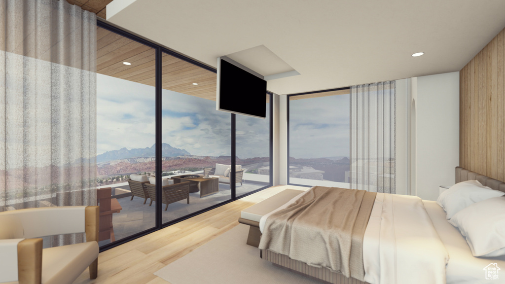 Bedroom with light wood-type flooring and floor to ceiling windows