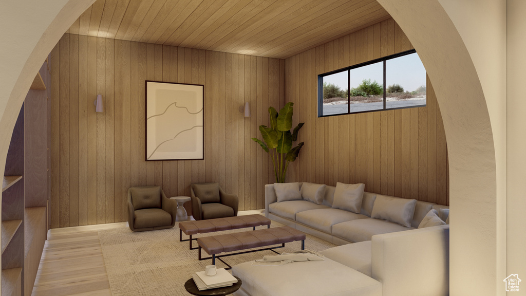 Living room with light hardwood / wood-style flooring, wooden ceiling, and wooden walls