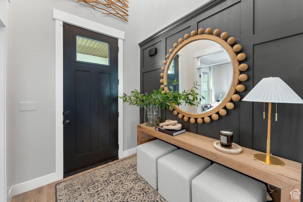 Foyer entrance with light wood-type flooring