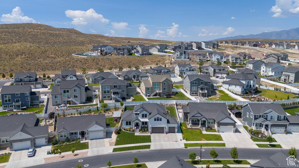 Birds eye view of property with a mountain view