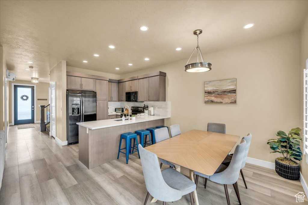 Dining area featuring light hardwood / wood-style flooring