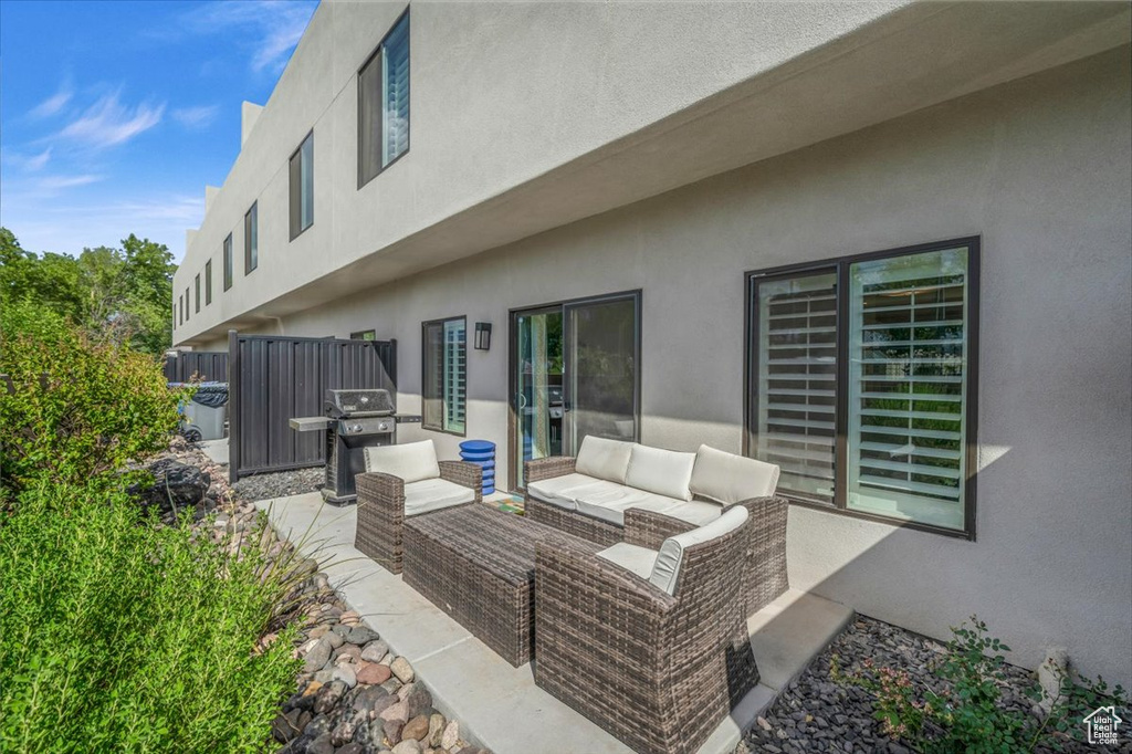 View of patio featuring area for grilling and an outdoor hangout area