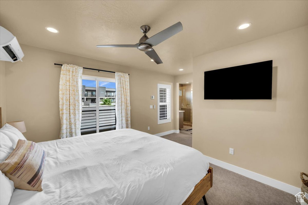 Bedroom with an AC wall unit, access to exterior, carpet floors, and ceiling fan