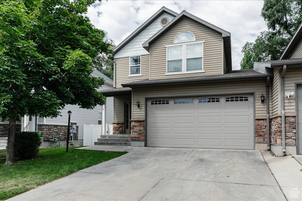 View of front of house with a garage