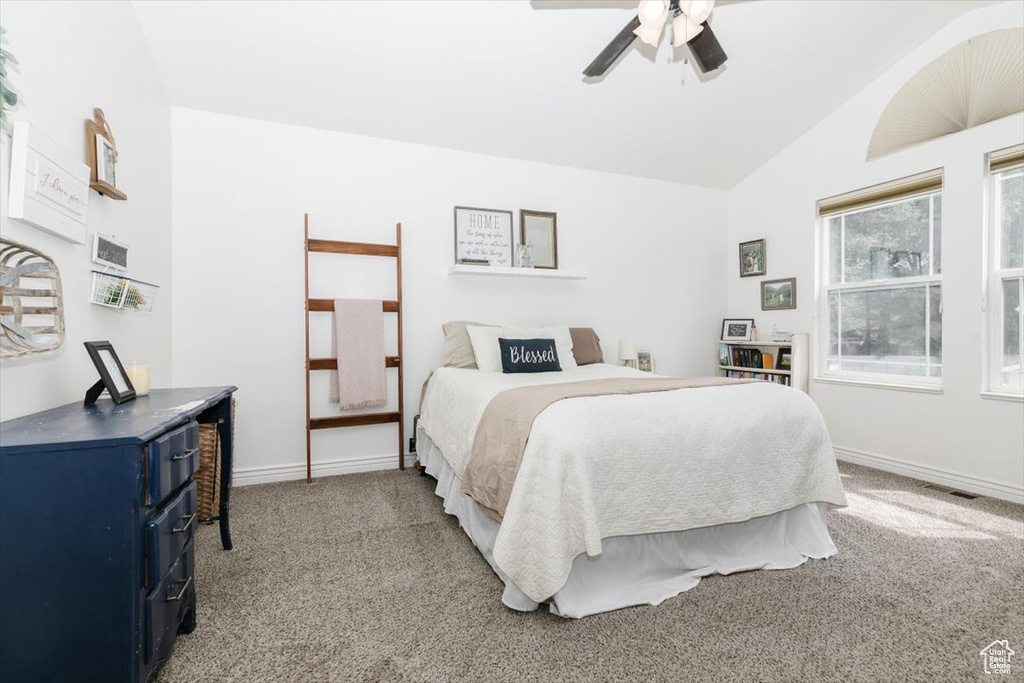 Bedroom featuring carpet, lofted ceiling, and ceiling fan