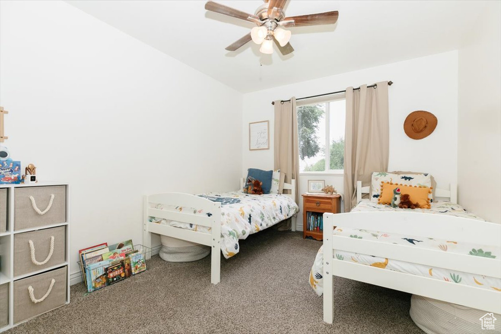 Bedroom featuring carpet flooring and ceiling fan