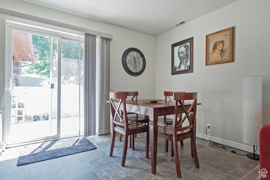 Dining space featuring tile patterned flooring