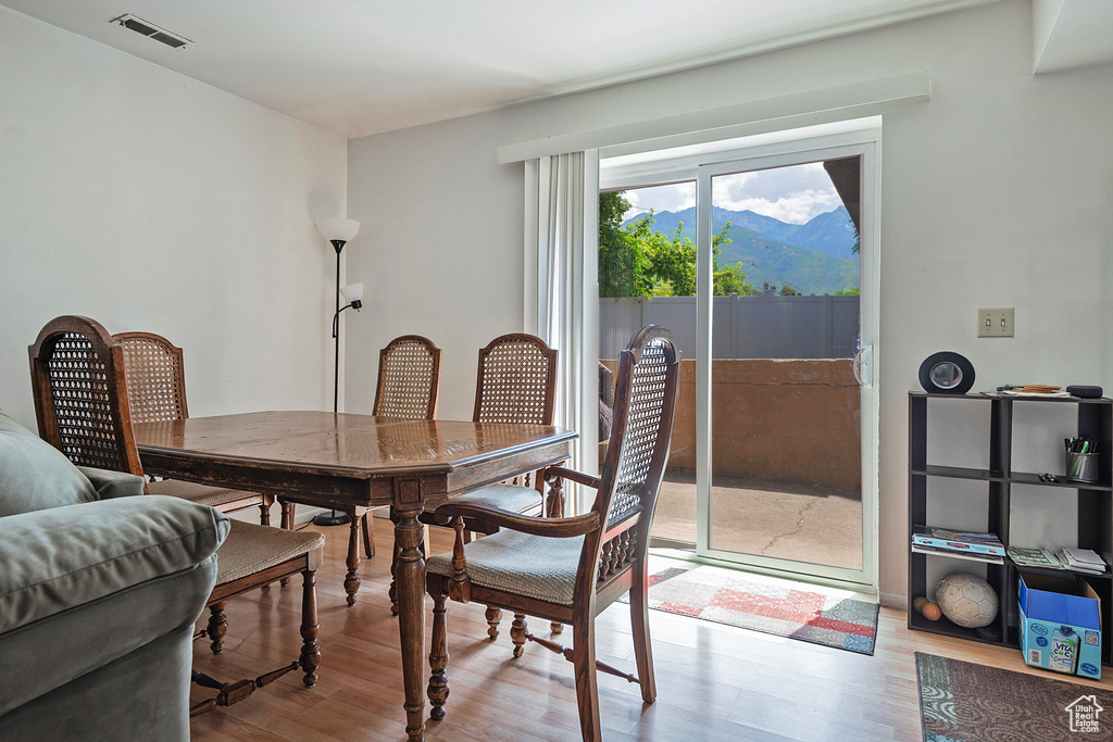 Dining space featuring a mountain view and light wood-type flooring