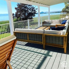 Wooden terrace with a water view and outdoor lounge area