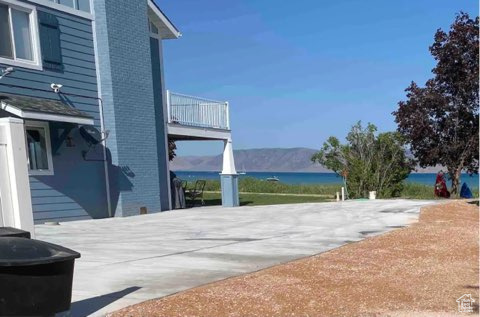 Exterior space with a balcony and a water view