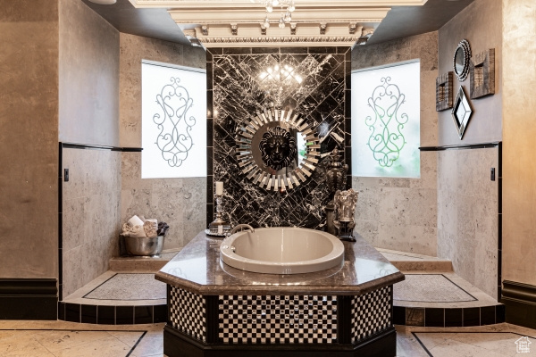 Bathroom featuring tile patterned floors and a bathtub