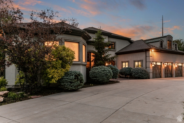 View of front facade featuring a garage