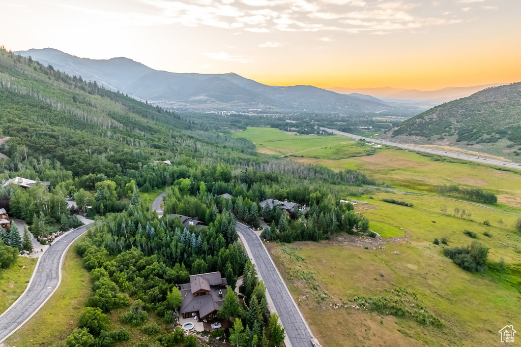 Aerial view at dusk featuring a mountain view