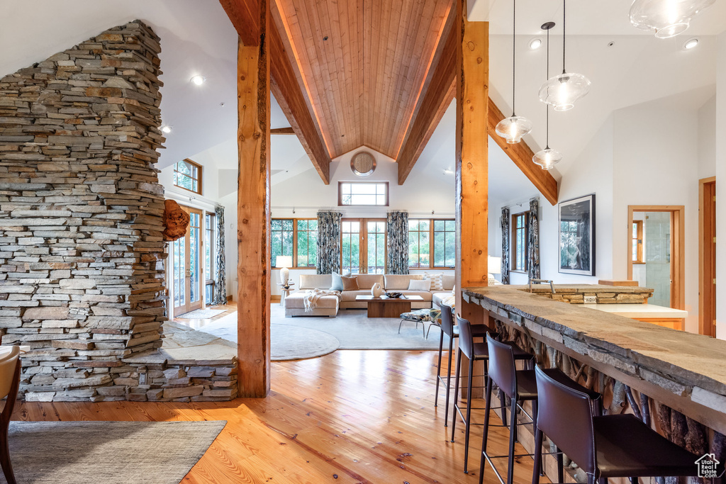 Interior space with light hardwood / wood-style flooring and high vaulted ceiling