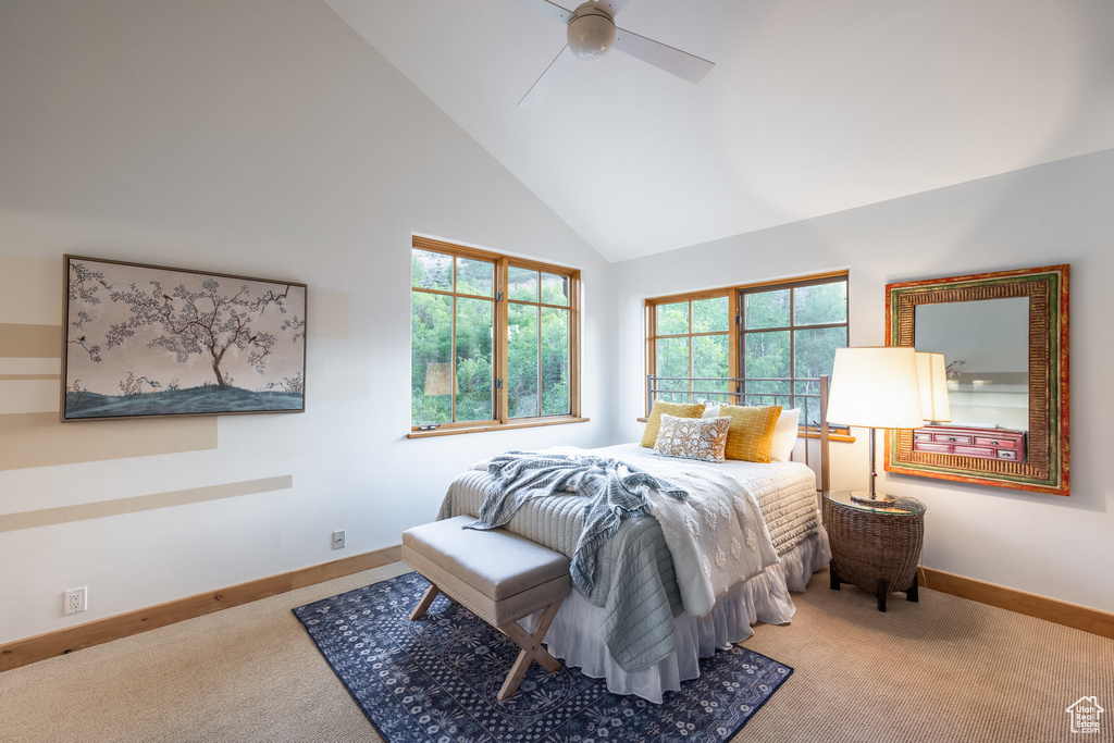 Bedroom with carpet floors, high vaulted ceiling, and ceiling fan