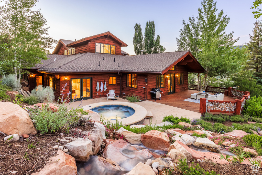 View of pool featuring area for grilling, a hot tub, and a patio area