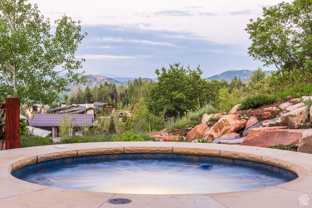 View of pool with a mountain view