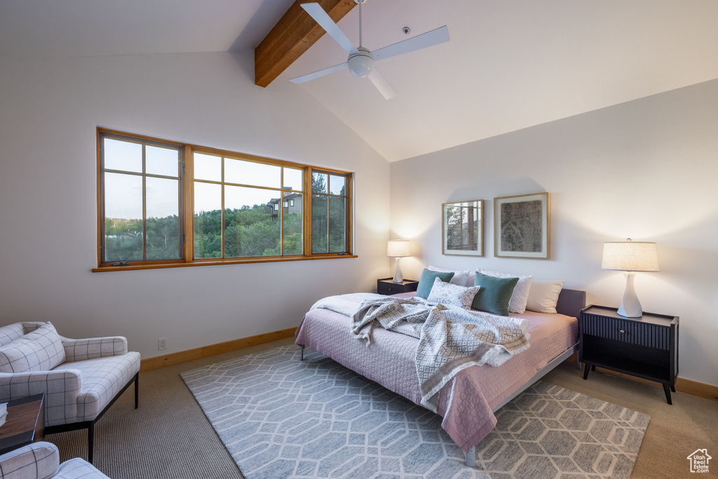 Carpeted bedroom featuring beamed ceiling, high vaulted ceiling, and ceiling fan