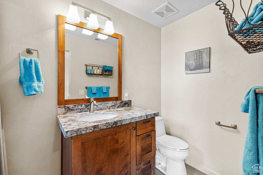 Bathroom with vanity and toilet