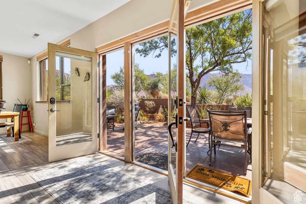 Doorway featuring hardwood / wood-style floors