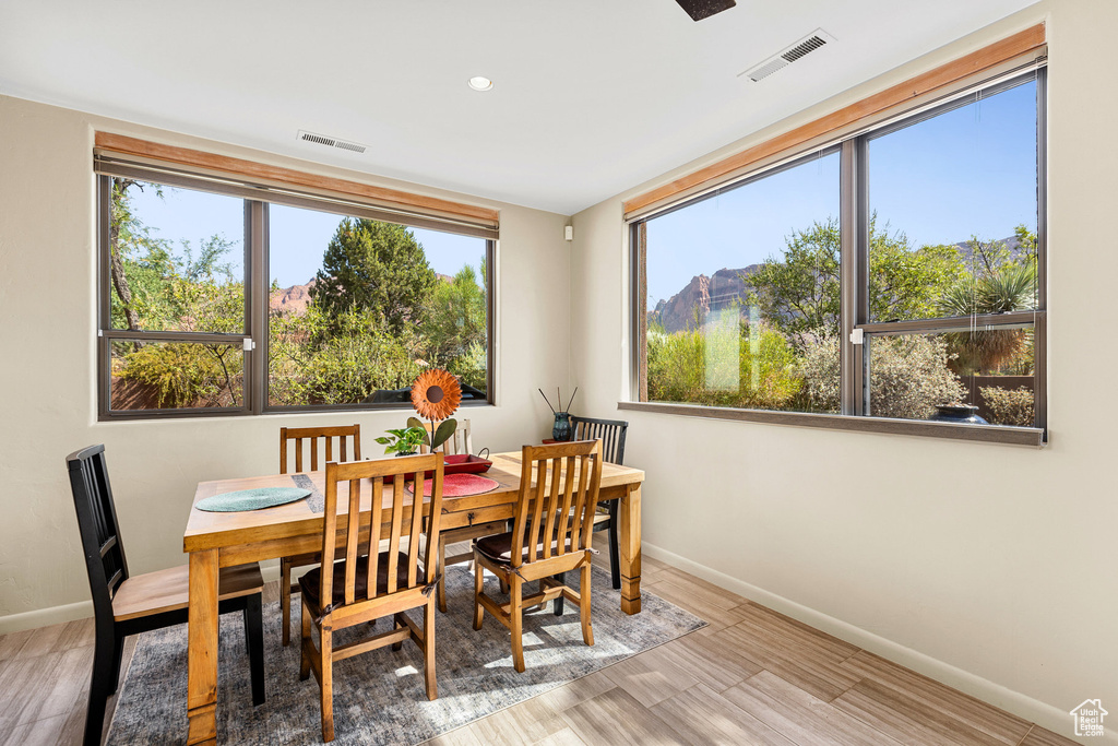 Dining area featuring a mountain view and light hardwood / wood-style floors