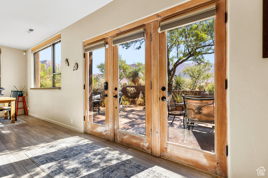 Doorway featuring french doors and hardwood / wood-style floors