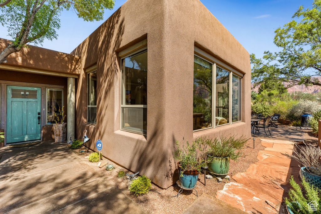 View of property exterior with a patio