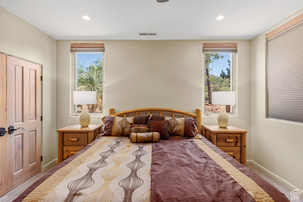 Bedroom featuring multiple windows