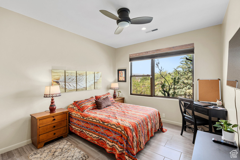 Bedroom featuring light wood-type flooring and ceiling fan