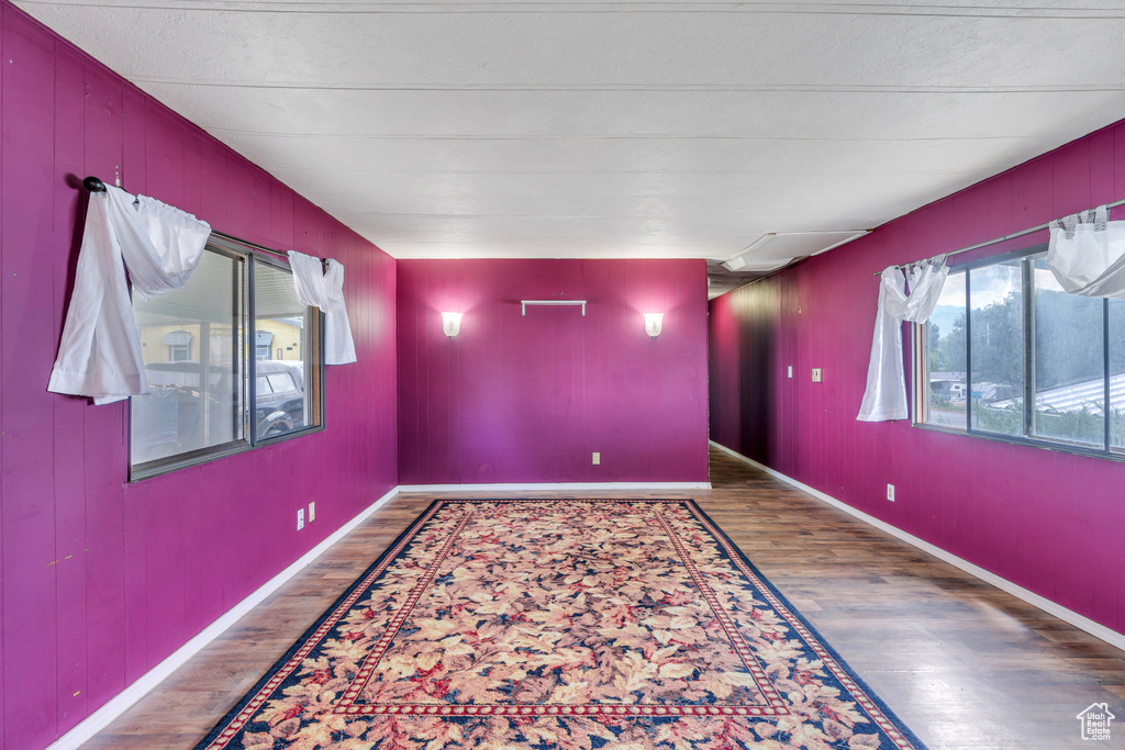 Spare room with dark wood-type flooring